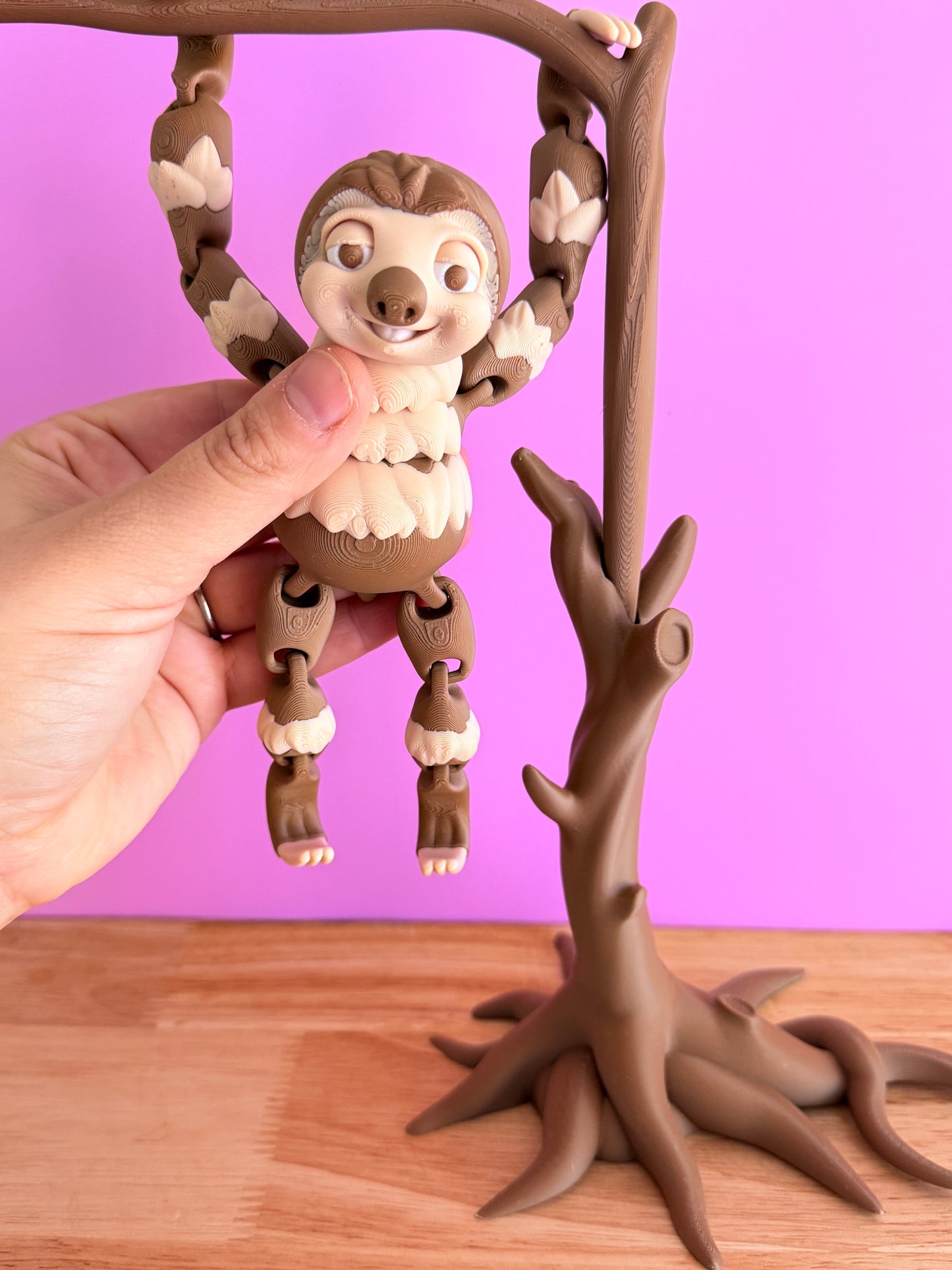 Hanging sloth with tree