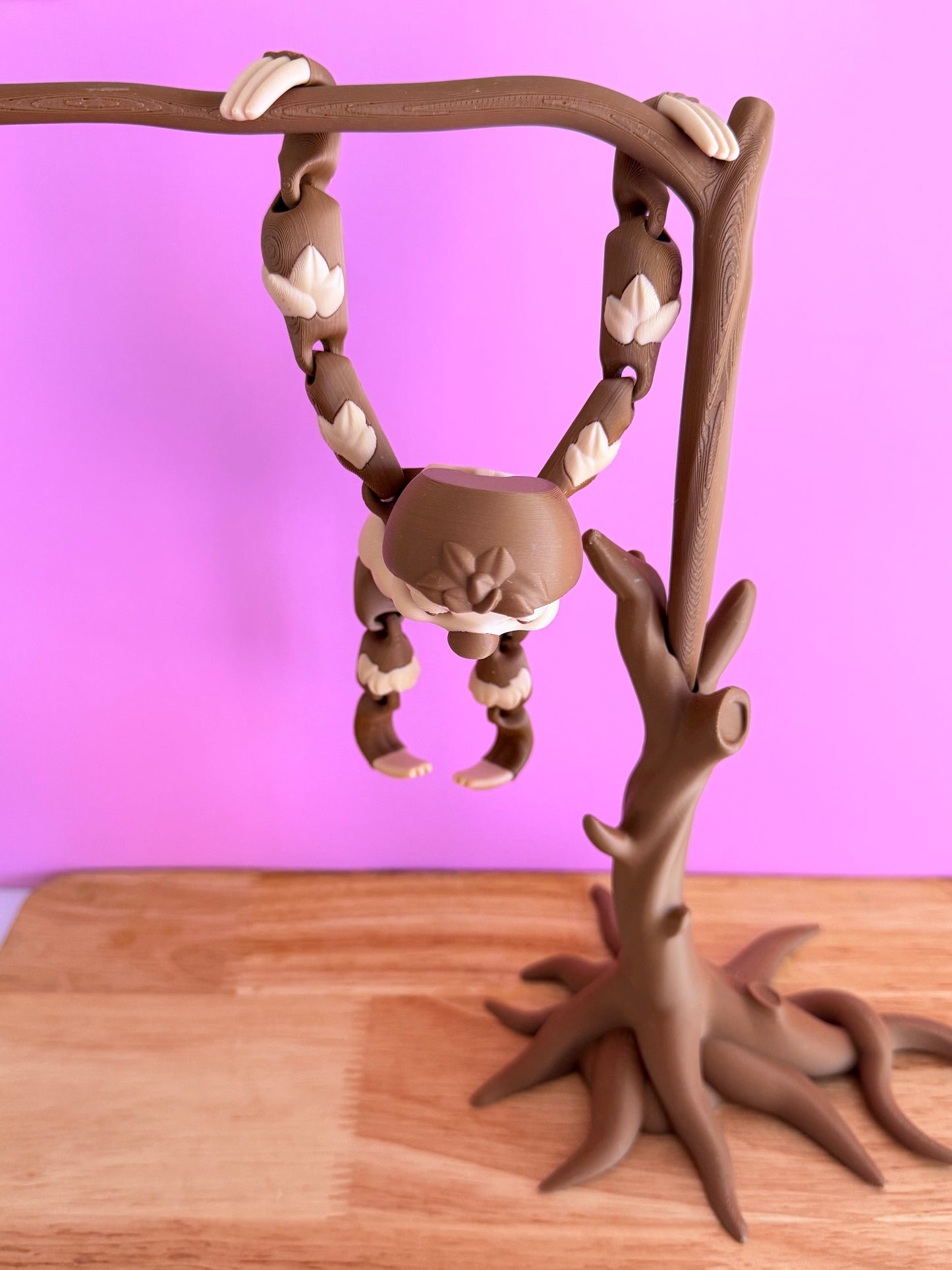 Hanging sloth with tree
